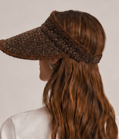 The shaded. visor in chocolate brown, worn from behind